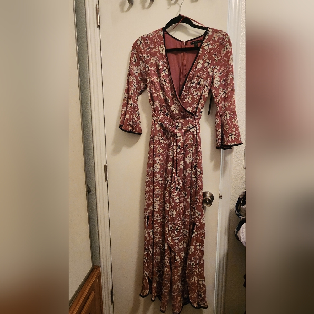 Lily Black Pink Jumpsuit does have a little tear on it size small